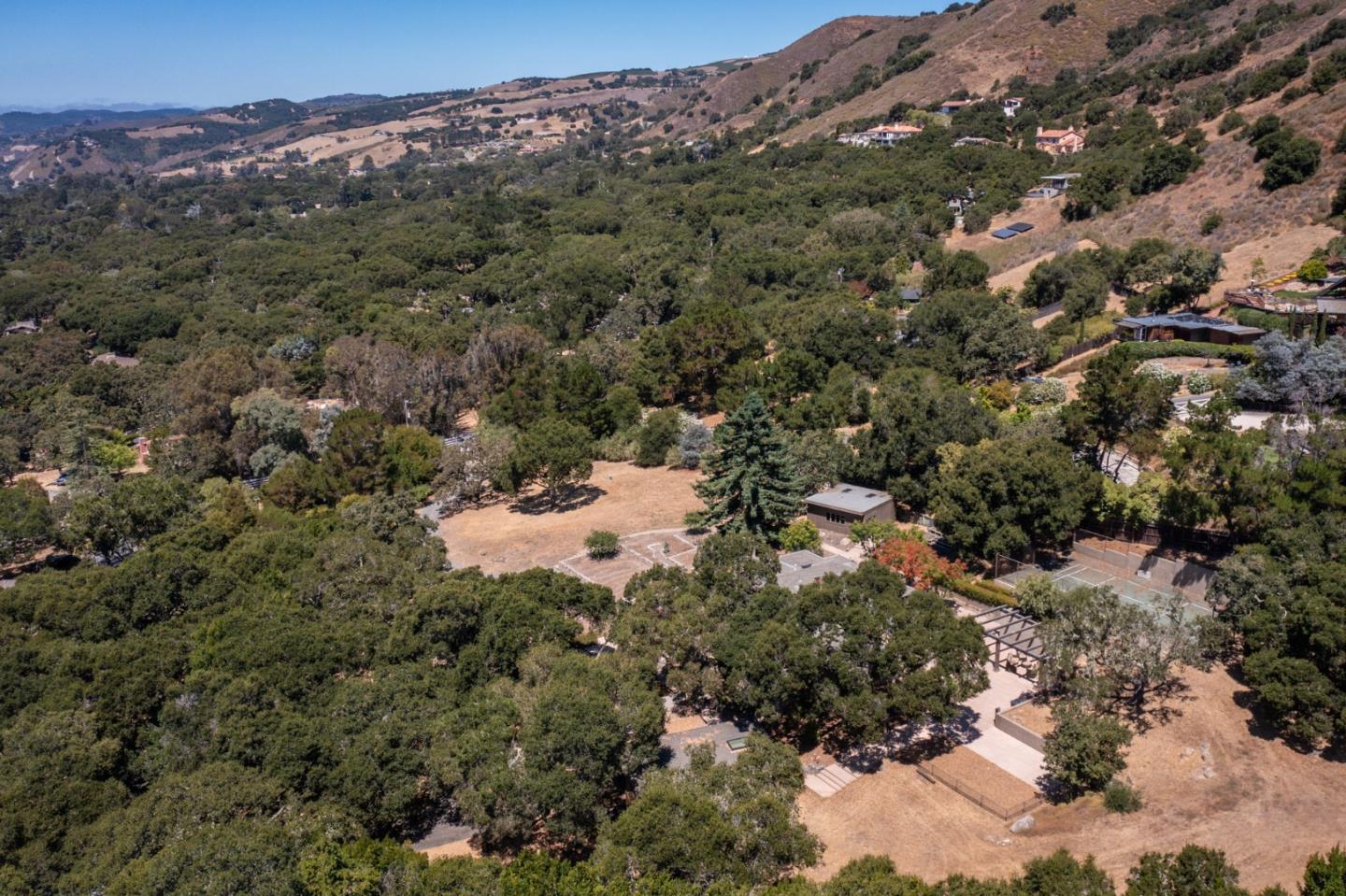 21 La Rancheria Carmel Valley, CA 93924 - Photo 43 of 44 a view of a forest with mountains in the background
