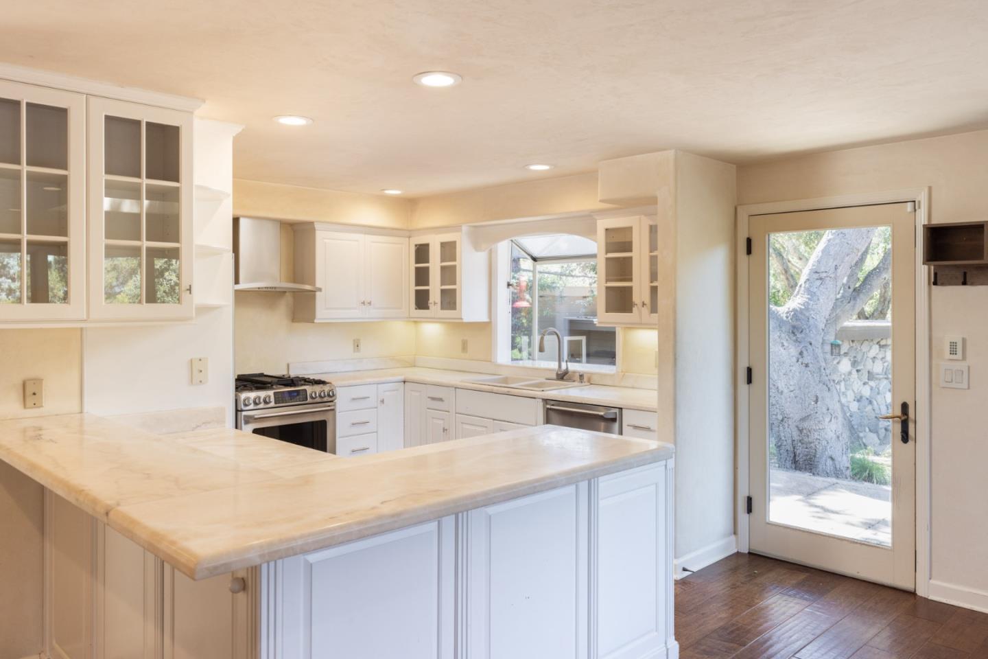 21 La Rancheria Carmel Valley, CA 93924 - Photo 8 of 44 a kitchen with stainless steel appliances granite countertop a sink and cabinets