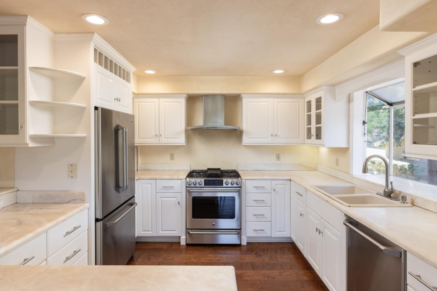 21 La Rancheria Carmel Valley, CA 93924 - Photo 9 of 44 a kitchen with a sink stove and refrigerator