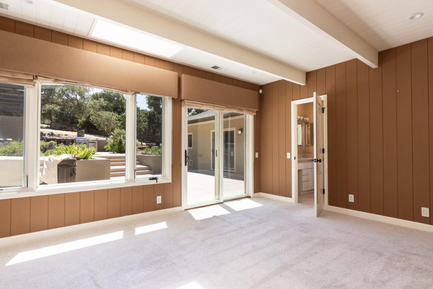 21 La Rancheria Carmel Valley, CA 93924 - Photo 10 of 44 a view of a big room with large windows and kitchen view
