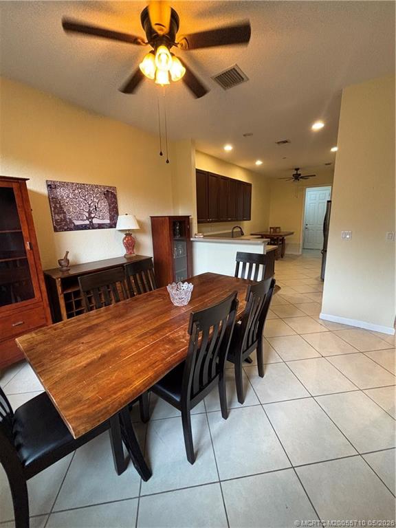 262 Southwest Walking Path, Unit 262 Stuart, FL 34997 - Photo 9 of 39 a view of a dining room with furniture
