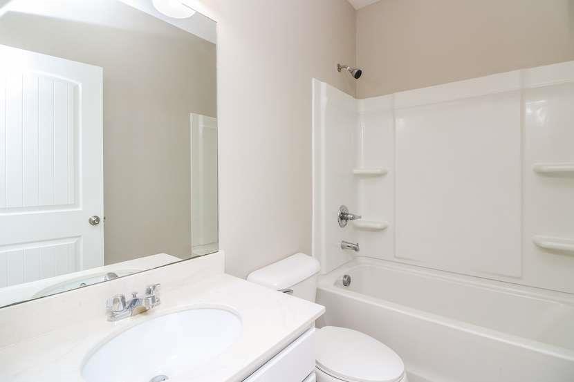 113 Howard Avenue Cartersville, GA 30121 - Photo 15 of 17 a bathroom with a sink toilet and bathtub