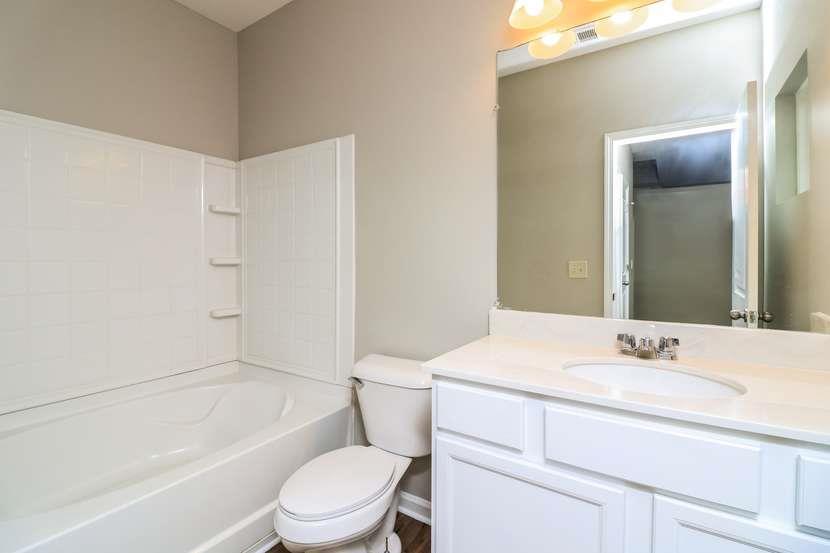 113 Howard Avenue Cartersville, GA 30121 - Photo 16 of 17 a bathroom with a sink a toilet and shower