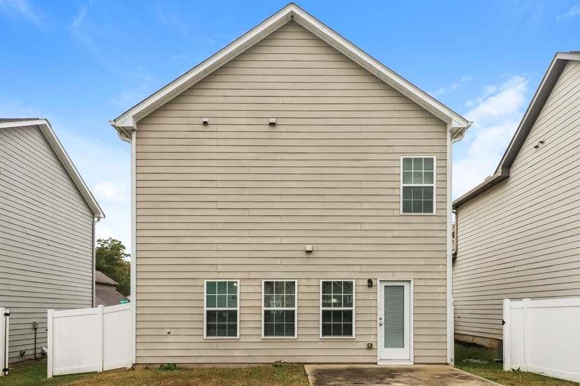 113 Howard Avenue Cartersville, GA 30121 - Photo 17 of 17 a view of a white house with large windows