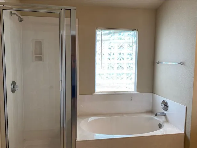 a white bath tub sitting next to a window