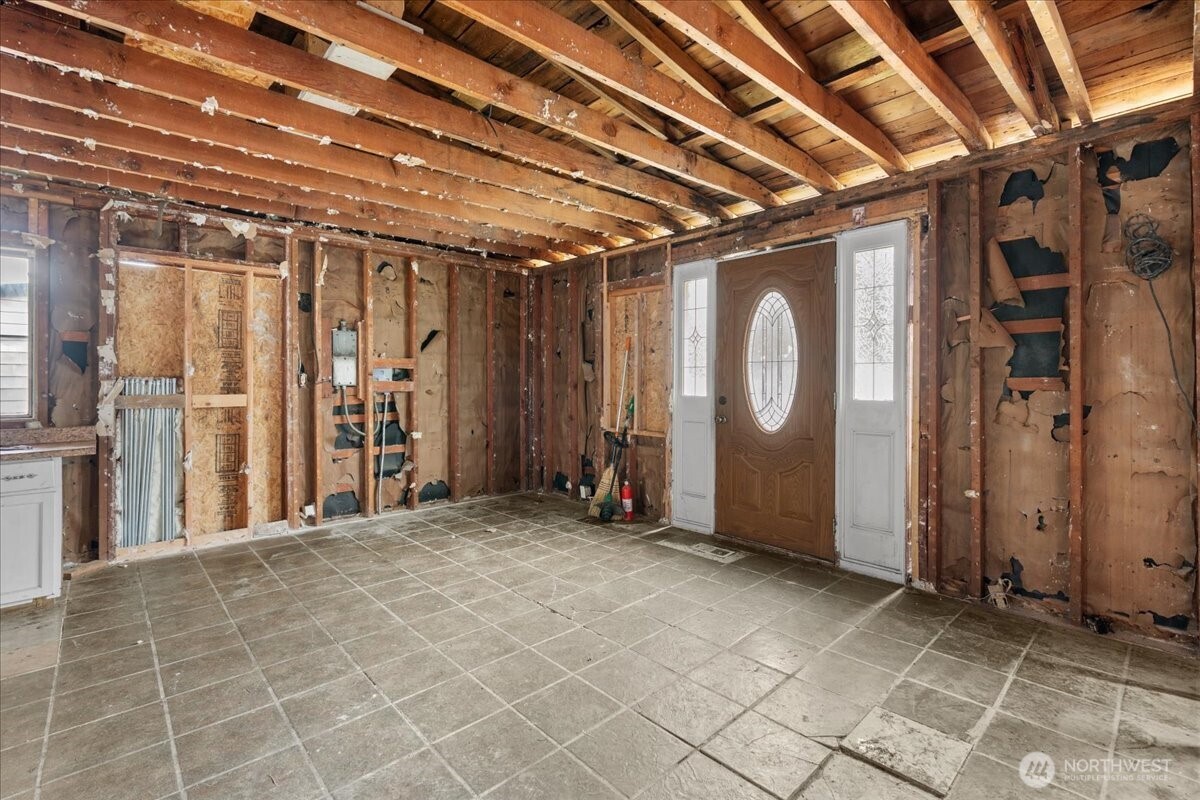 919 Edmonds Avenue Northeast Renton, WA 98056 - Photo 3 of 15 a view of a room with wooden walls