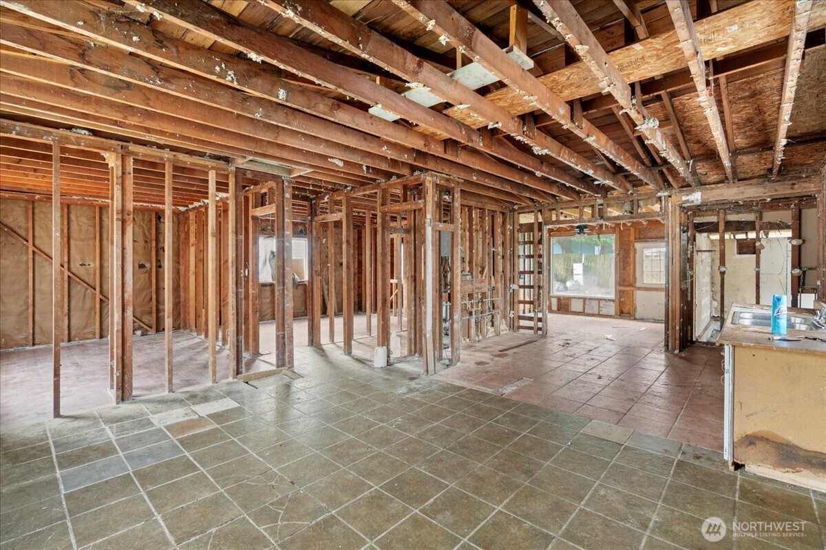 919 Edmonds Avenue Northeast Renton, WA 98056 - Photo 5 of 15 a view of a room with wooden walls