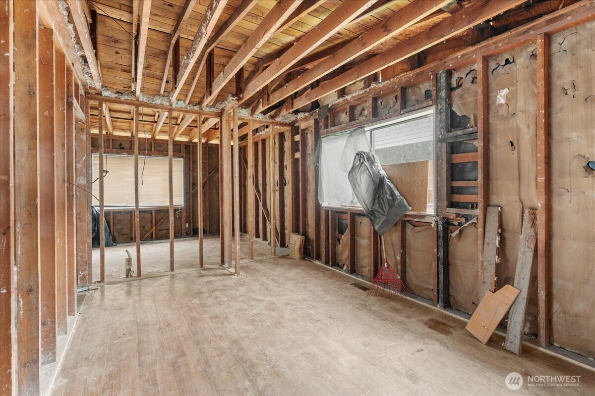 919 Edmonds Avenue Northeast Renton, WA 98056 - Photo 8 of 15 a view of an empty room with wooden walls