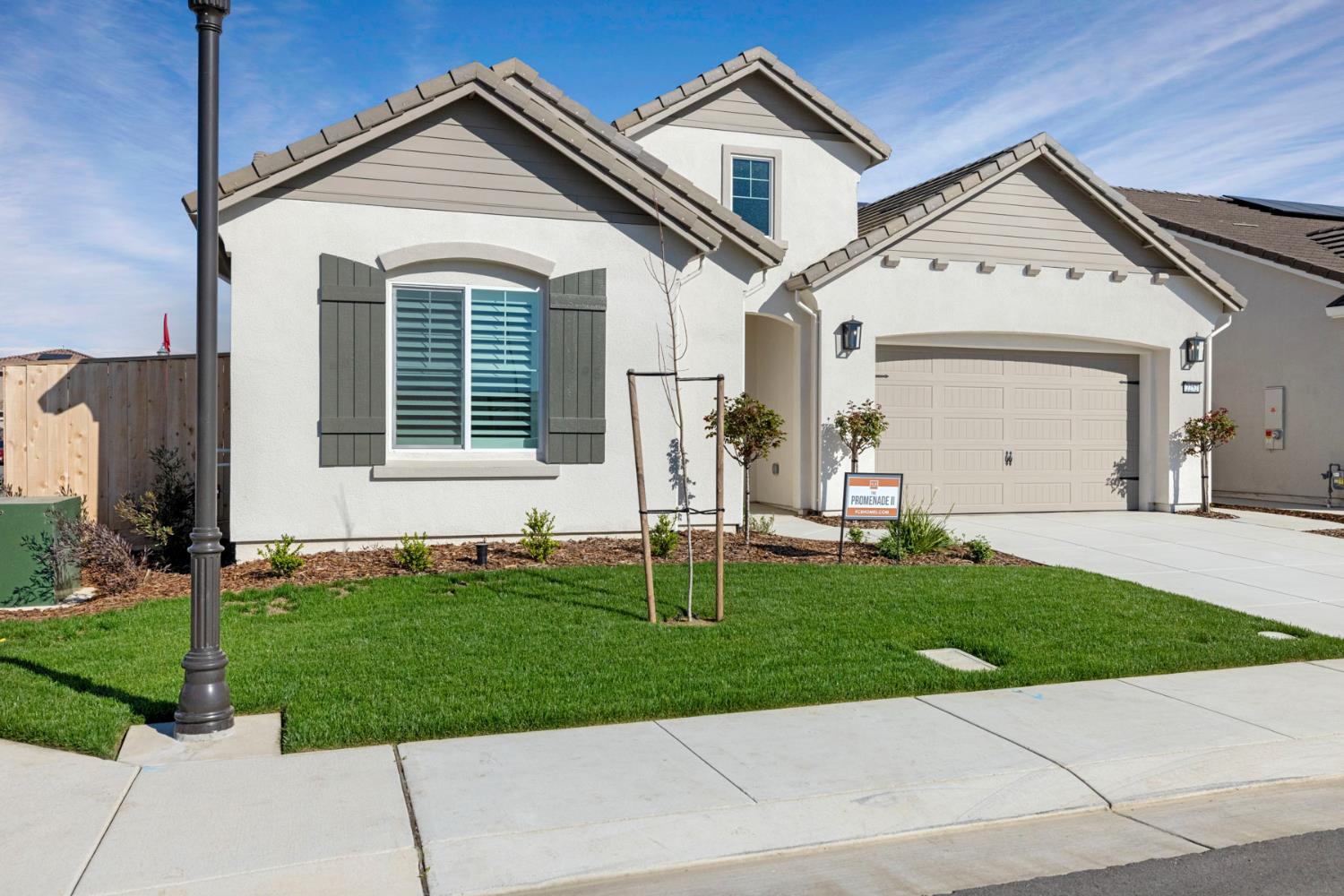 2252 Lyndon Street Lodi, CA 95242 - Photo 1 of 23 a view of a white house with a big yard and potted plants