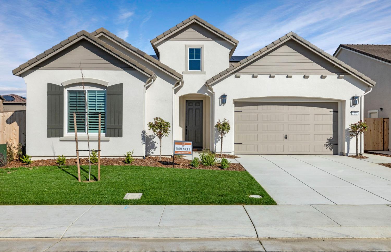 2252 Lyndon Street Lodi, CA 95242 - Photo 2 of 23 a front view of a house with a yard and garage