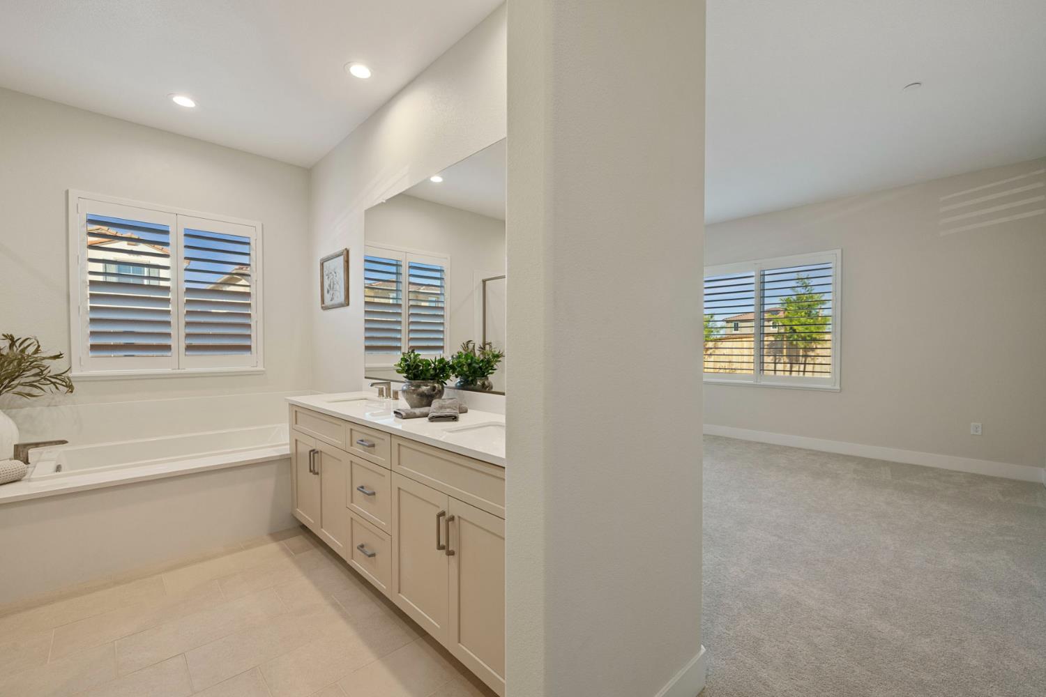 2252 Lyndon Street Lodi, CA 95242 - Photo 9 of 23 a bathroom with a tub sink and mirror