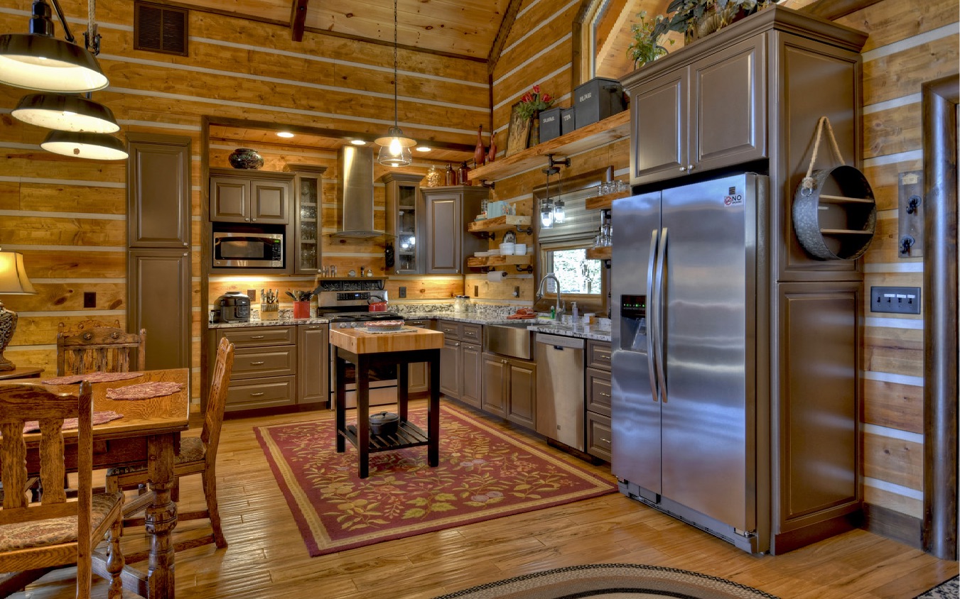 2124 Maxwell Road Blue Ridge, GA 30513 - Photo 14 of 66 a kitchen with stainless steel appliances kitchen island granite countertop a refrigerator a stove and a sink with wooden floor