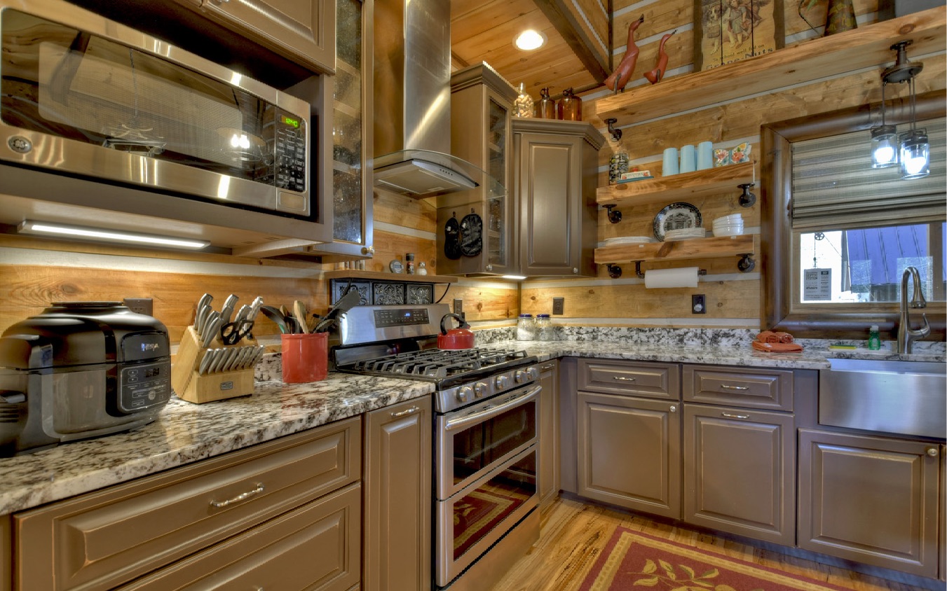 2124 Maxwell Road Blue Ridge, GA 30513 - Photo 16 of 66 a kitchen with granite countertop a sink a stove and cabinets