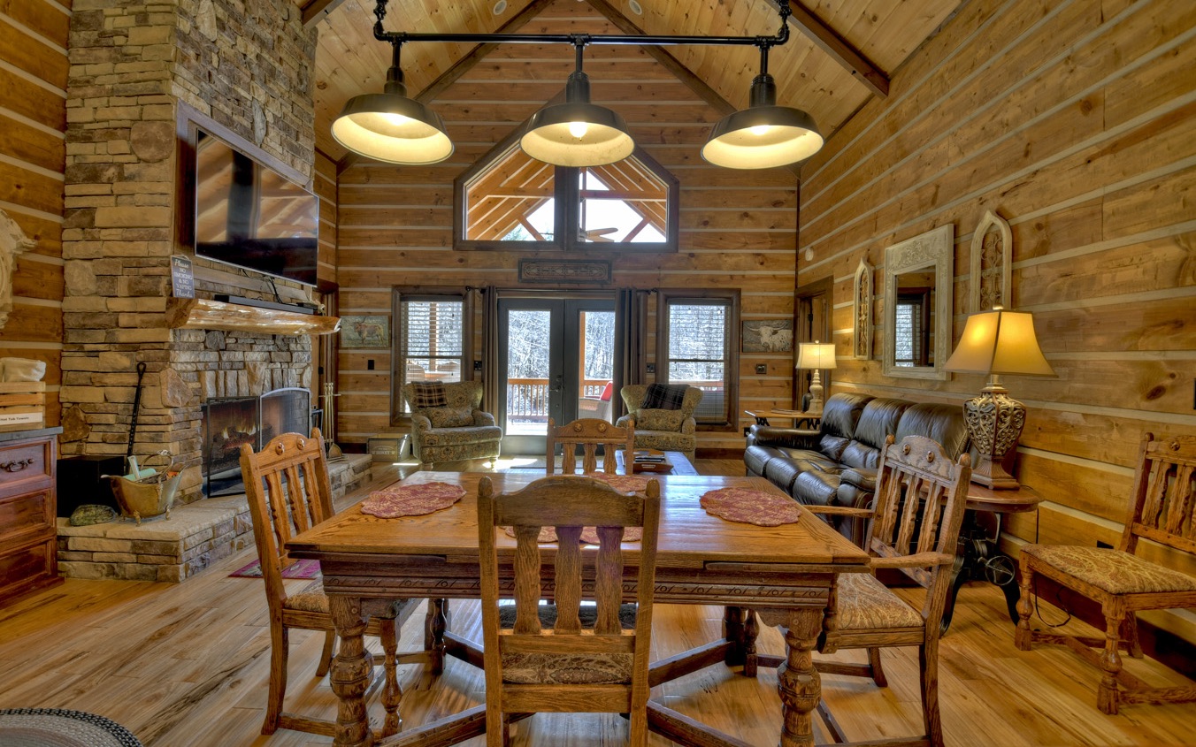 2124 Maxwell Road Blue Ridge, GA 30513 - Photo 19 of 66 a view of a dining room with furniture and chandelier