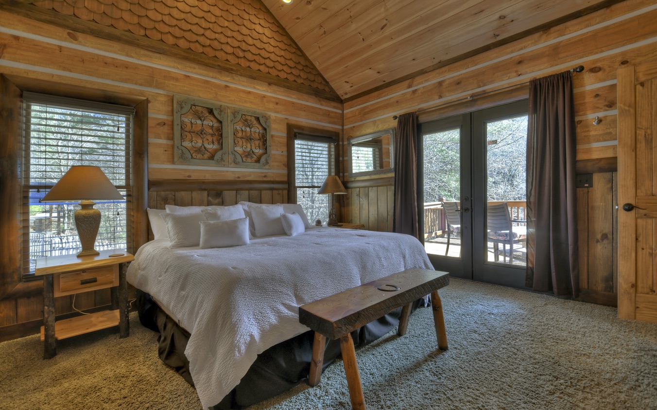 2124 Maxwell Road Blue Ridge, GA 30513 - Photo 26 of 66 a bed sitting in a spacious bedroom next to a window