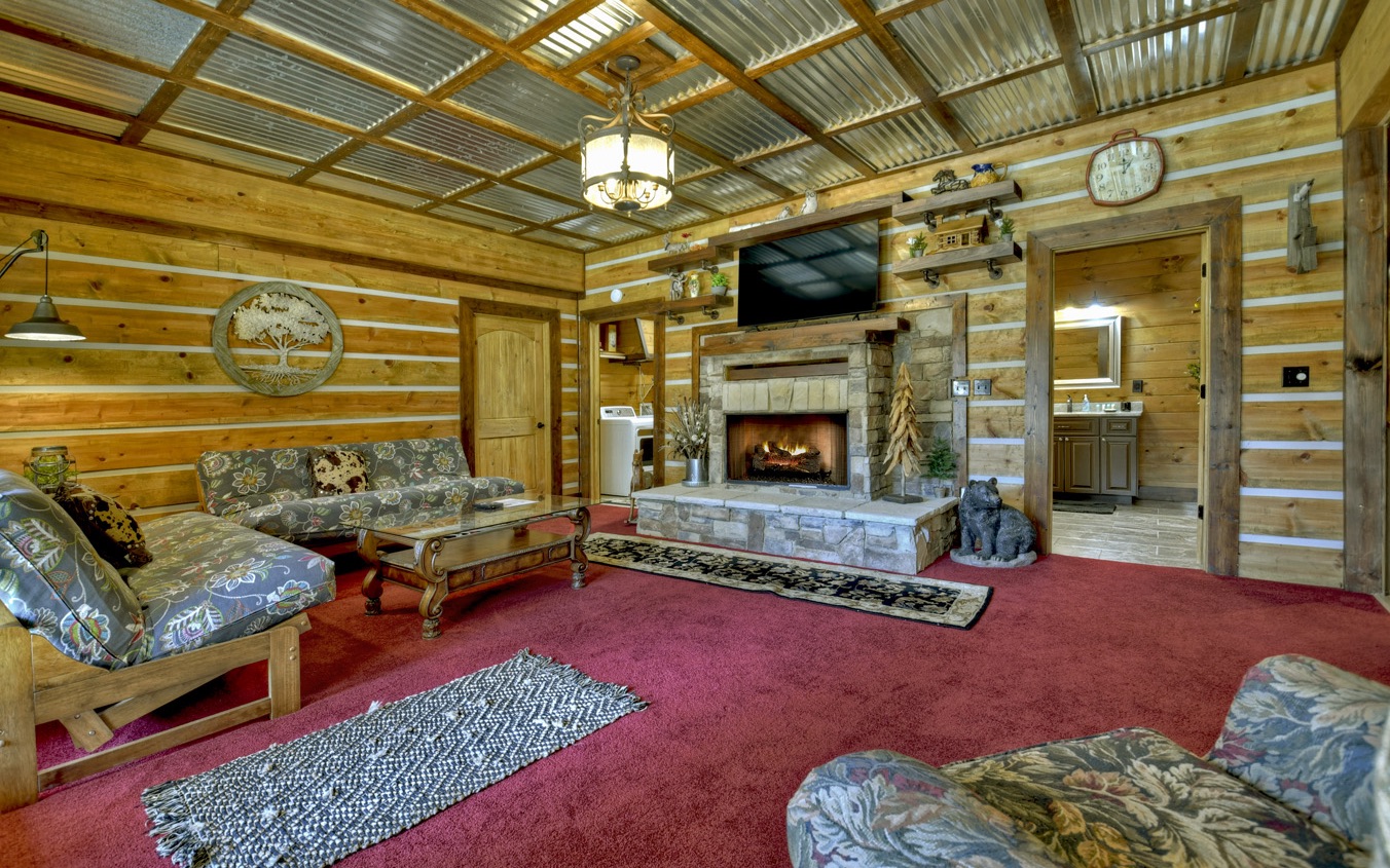 2124 Maxwell Road Blue Ridge, GA 30513 - Photo 30 of 66 a living room with furniture and a fireplace