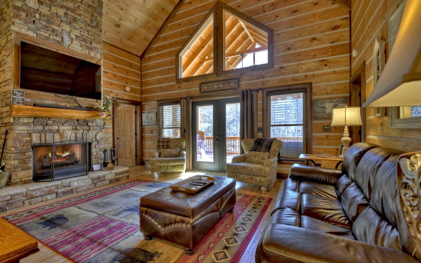 2124 Maxwell Road Blue Ridge, GA 30513 - Photo 3 of 66 a living room with furniture a fireplace and a flat screen tv