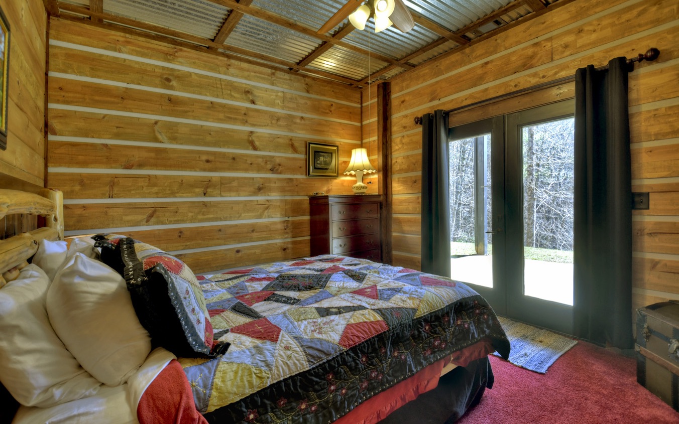 2124 Maxwell Road Blue Ridge, GA 30513 - Photo 33 of 66 a bedroom with a bed and a window