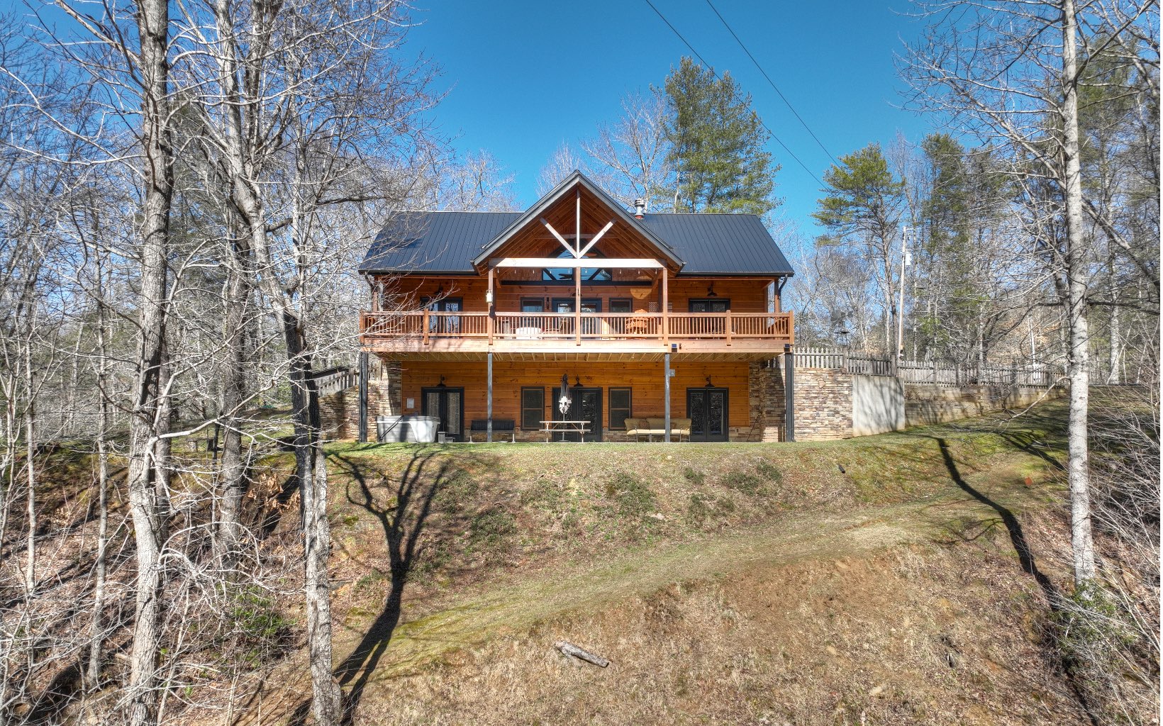 2124 Maxwell Road Blue Ridge, GA 30513 - Photo 47 of 66 a front view of a house with yard and trees