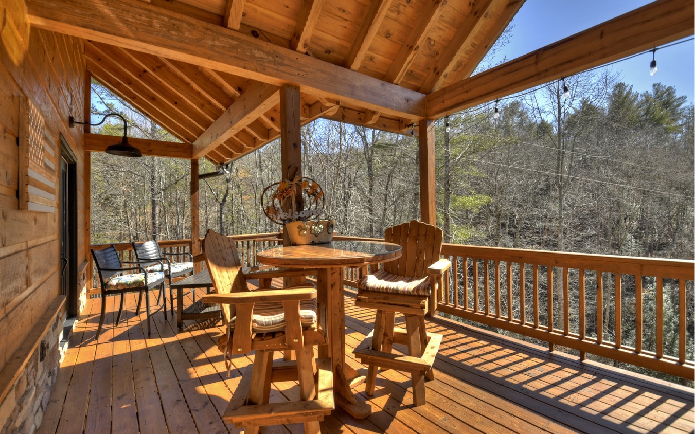 2124 Maxwell Road Blue Ridge, GA 30513 - Photo 55 of 66 a view of balcony with couch and wooden floor