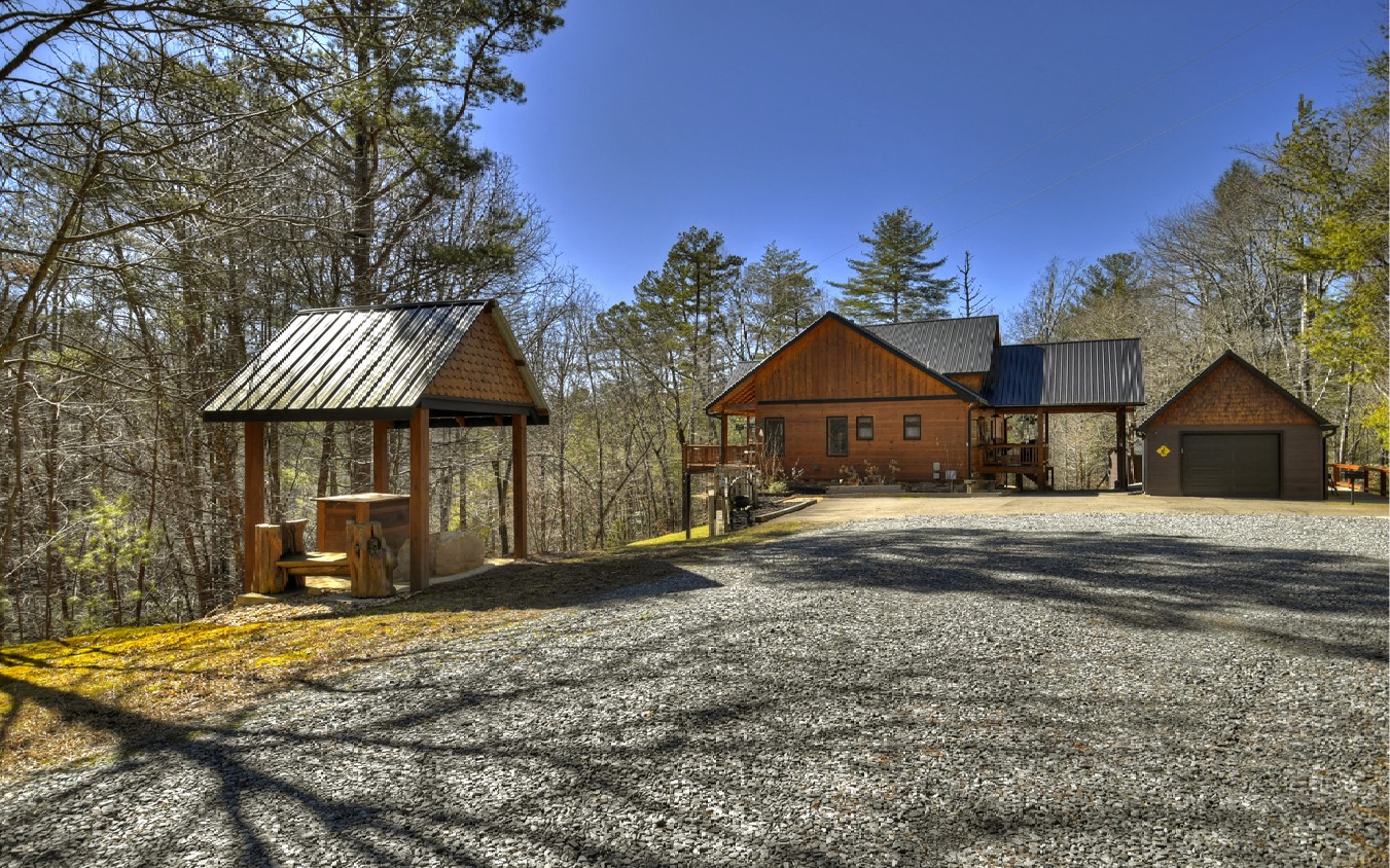 2124 Maxwell Road Blue Ridge, GA 30513 - Photo 65 of 66 a front view of a house with a yard