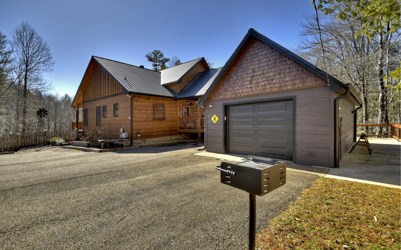 2124 Maxwell Road Blue Ridge, GA 30513 - Photo 8 of 66 a front view of a house with yard