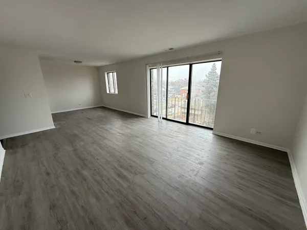 a view of a livingroom with wooden floor