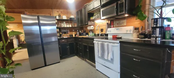 a kitchen with a sink cabinets and appliances