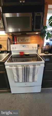 a picture of floor with a white wall and white cabinet
