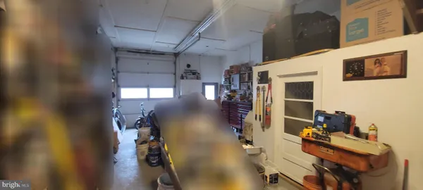 a view of a livingroom with furniture and a workspace