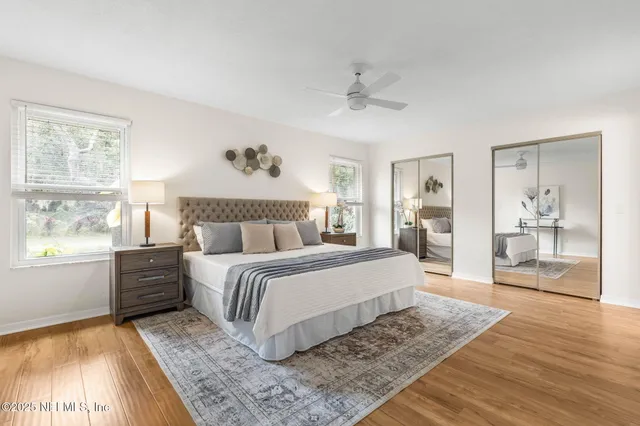 a spacious bedroom with a large bed and a window