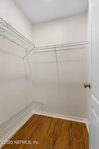 a view of a room with racks on the wall