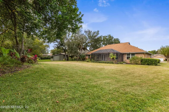 a yellow and red umbrella in front of house