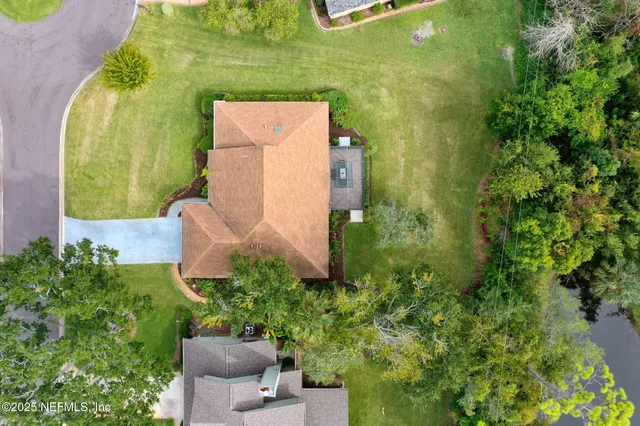 an aerial view of a house with a garden