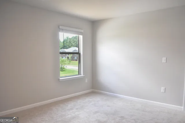 an empty room with window