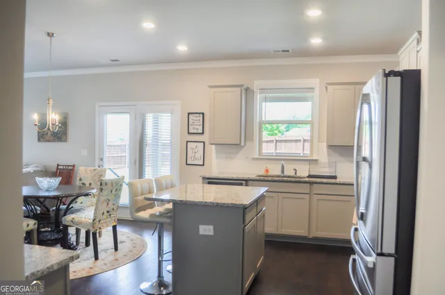 a kitchen with sink cabinets and wooden floor