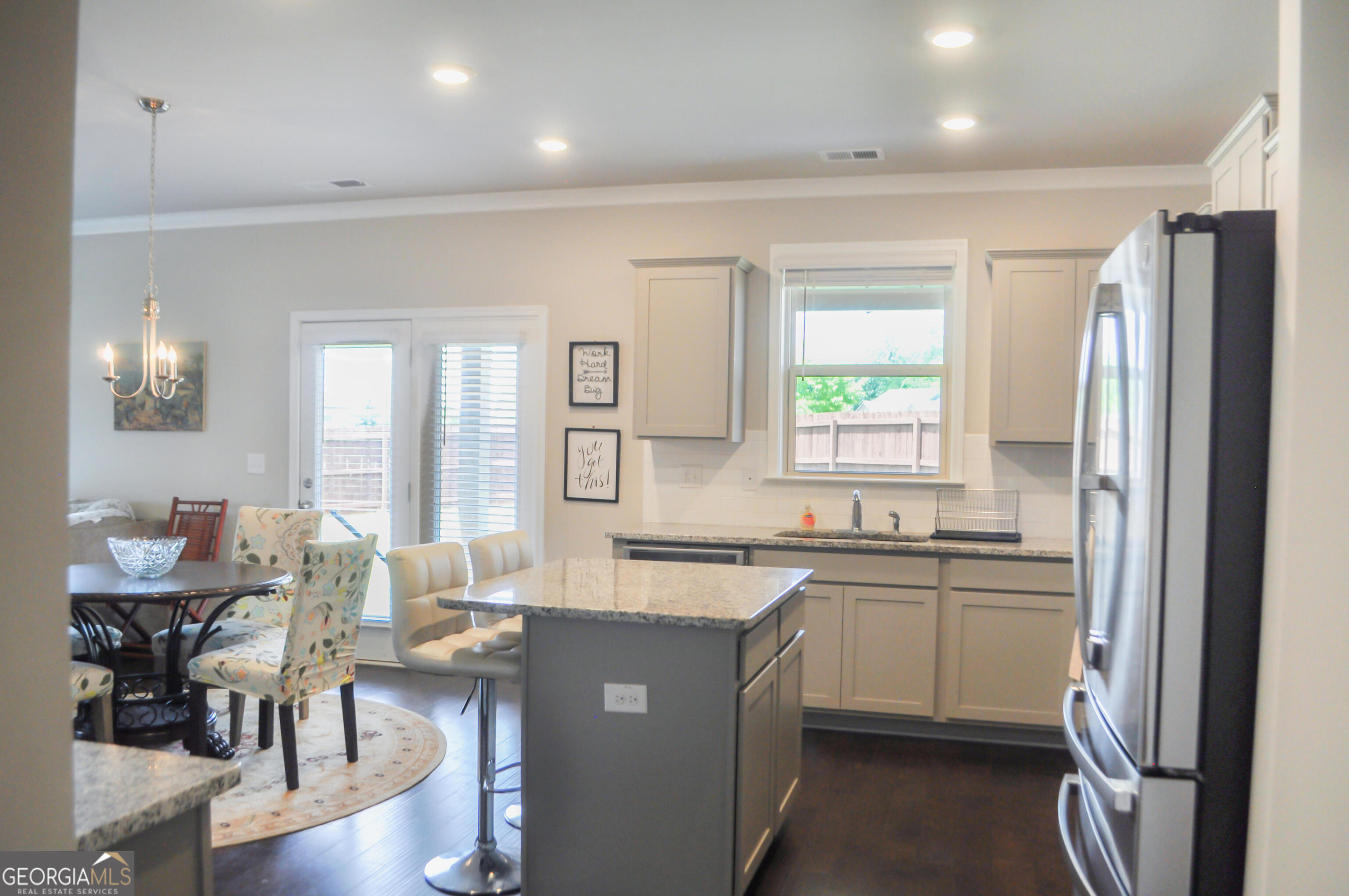 1493 Harlequin Way Stockbridge, GA 30281 - Photo 4 of 15 a kitchen with sink cabinets and wooden floor