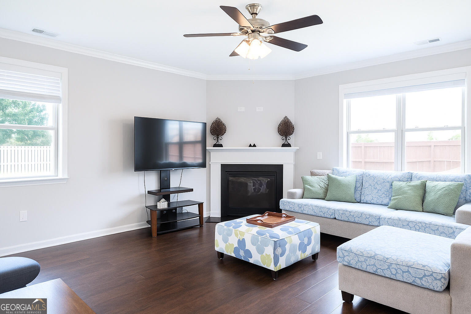 1493 Harlequin Way Stockbridge, GA 30281 - Photo 6 of 15 a living room with furniture a fireplace and a flat screen tv