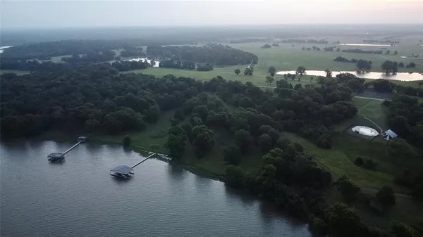 a view of a lake with a building in the background