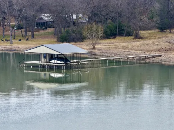 a view of a lake with a yard
