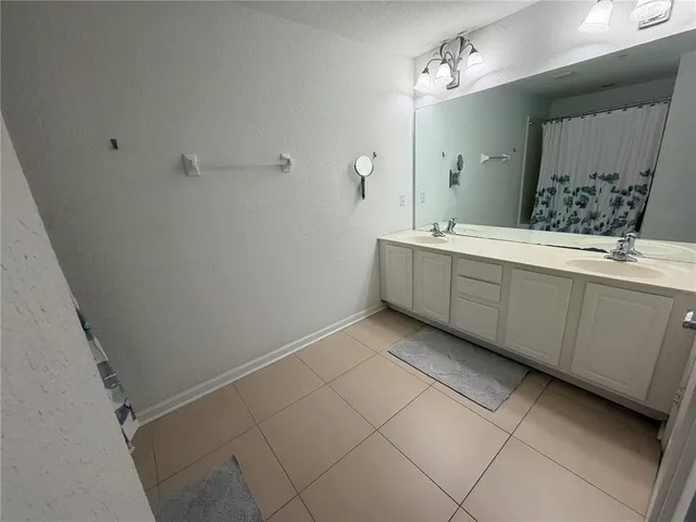 a bathroom with a sink and mirror