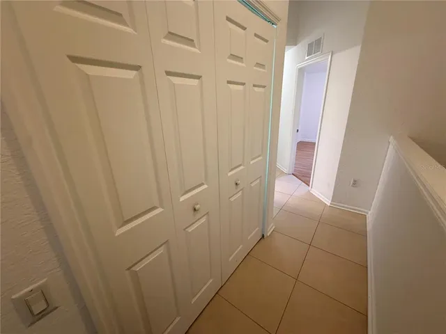 a view of a hallway with white walls