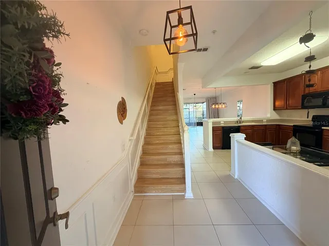 a kitchen with granite countertop a stove a sink and dishwasher