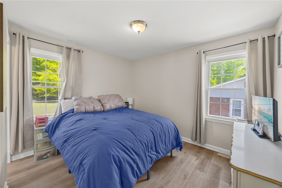 309 East Hampton Avenue Honea Path, SC 29654 - Photo 17 of 23 This inviting bedroom features ample natural light and durable flooring for comfortable living.