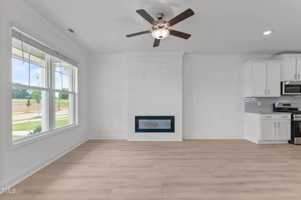 a view of kitchen with sink and wooden floor