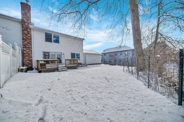 a view of a house with a snow in the yard
