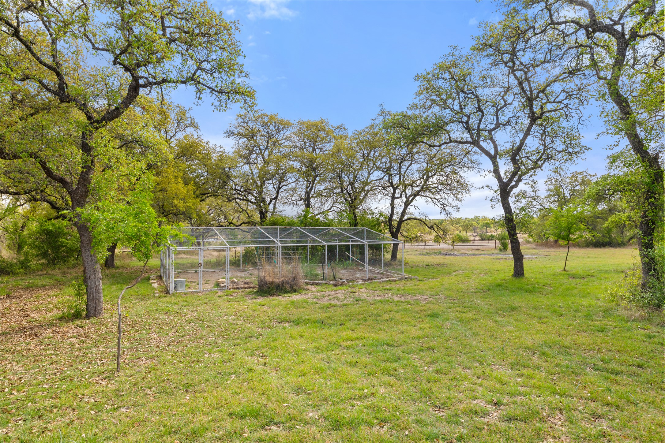 546 Lazy Oak Road Hye, TX 78635 - Photo 32 of 34 a view of a house with a yard