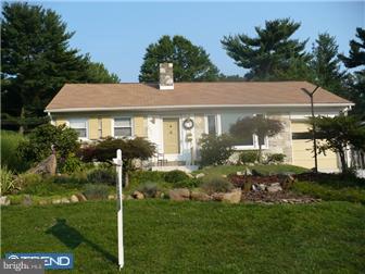 1437 Shoemaker Road Abington, PA 19001 - Photo 2 of 12 a front view of a house with a garden
