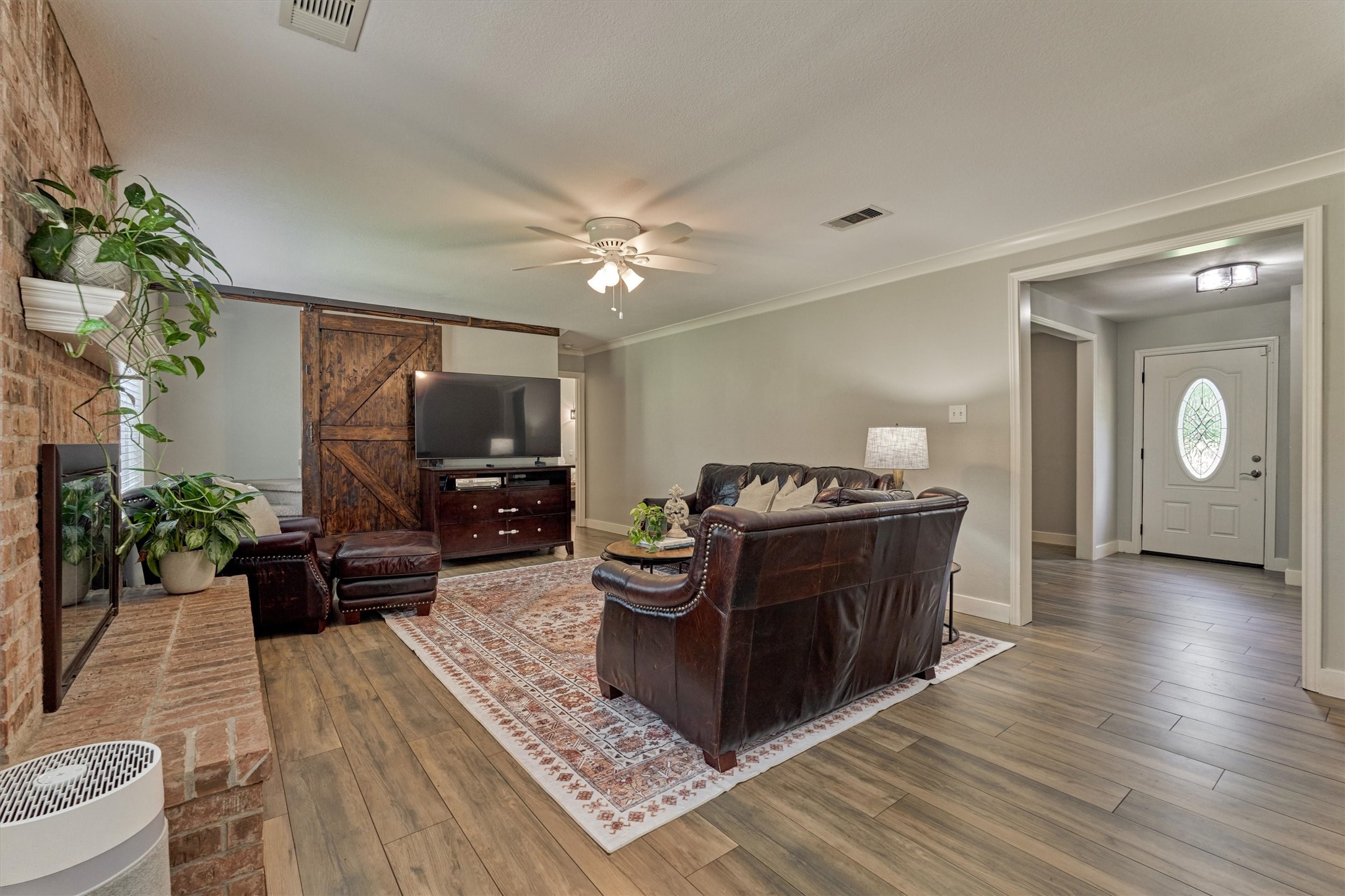 6515 Glenhill Drive Spring, TX 77389 - Photo 15 of 39 a living room with furniture and a fireplace