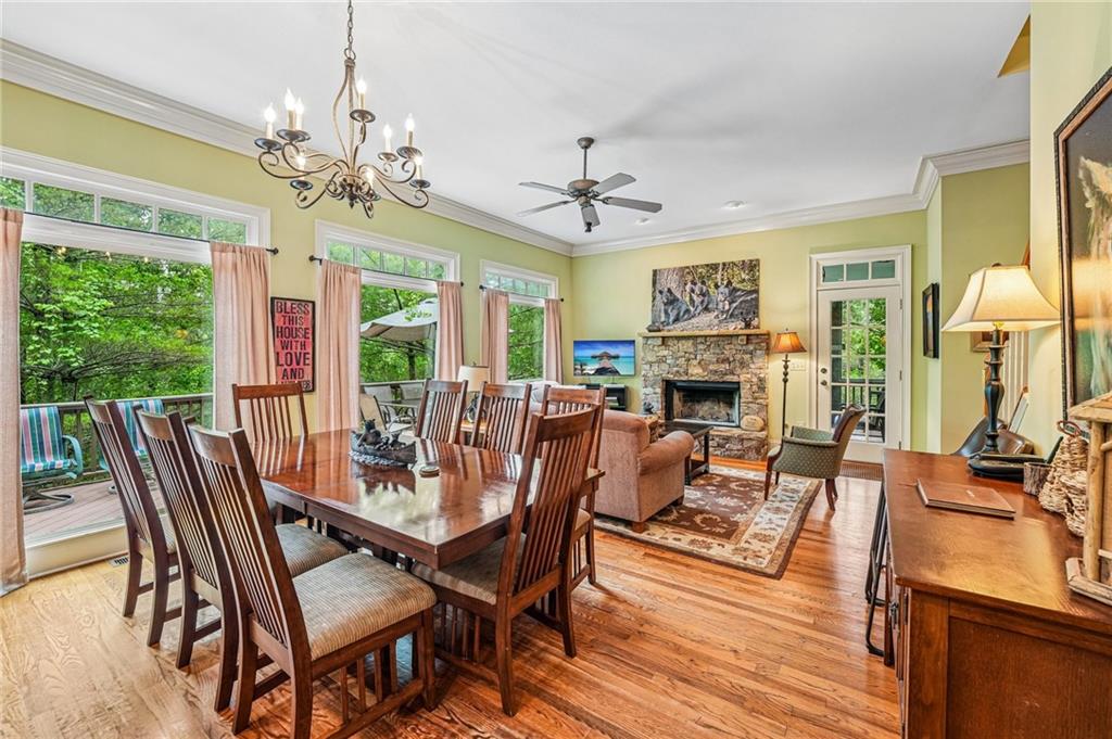 14 Laurel Ridge Lane Big Canoe, GA 30143 - Photo 15 of 72 a view of a dining room with furniture wooden floor and chandelier